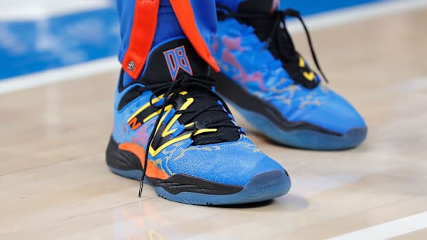 View of blue and black New Balance shoes.